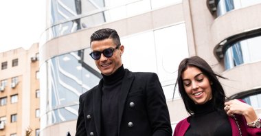 Portuguese player Cristiano Ronaldo leaves from the provincial court of Madrid with his girlfriend Georgina Rodriguez from his tax evasion trial, Madrid, Spain, Jan. 22, 2019. (Getty Images Photo)