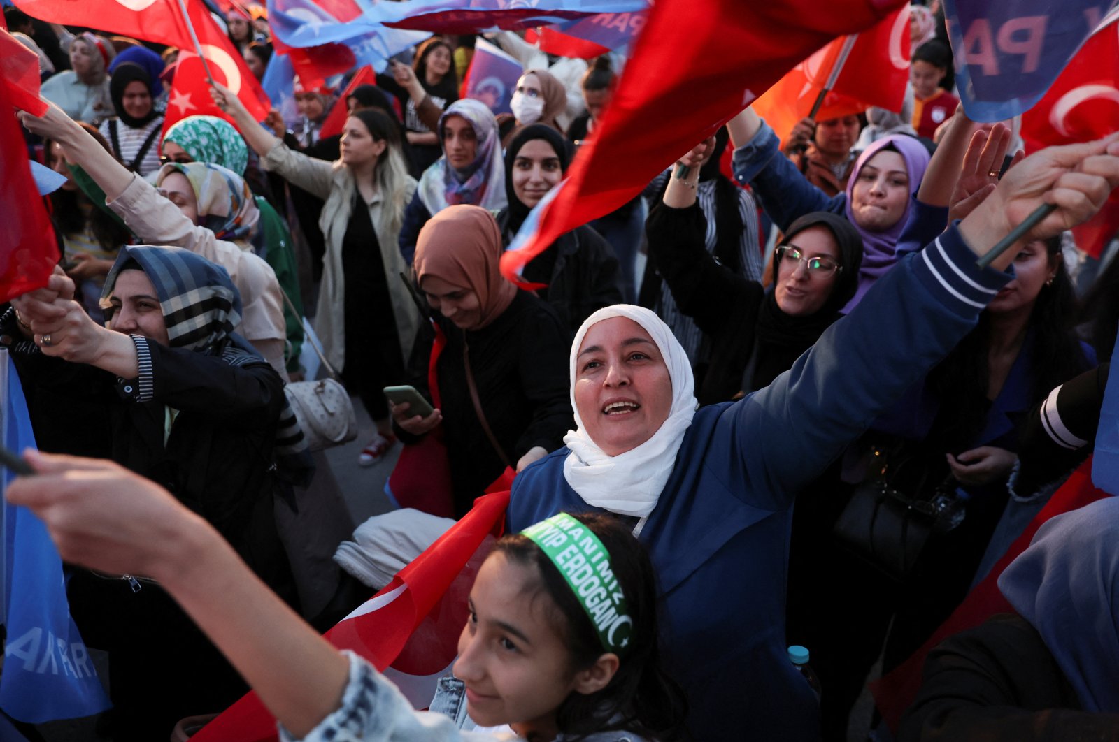 Supporters of President Recep Tayyip Erdoğan react after early exit polls in Ankara, Türkiye, May 14, 2023. (Reuters Photo)