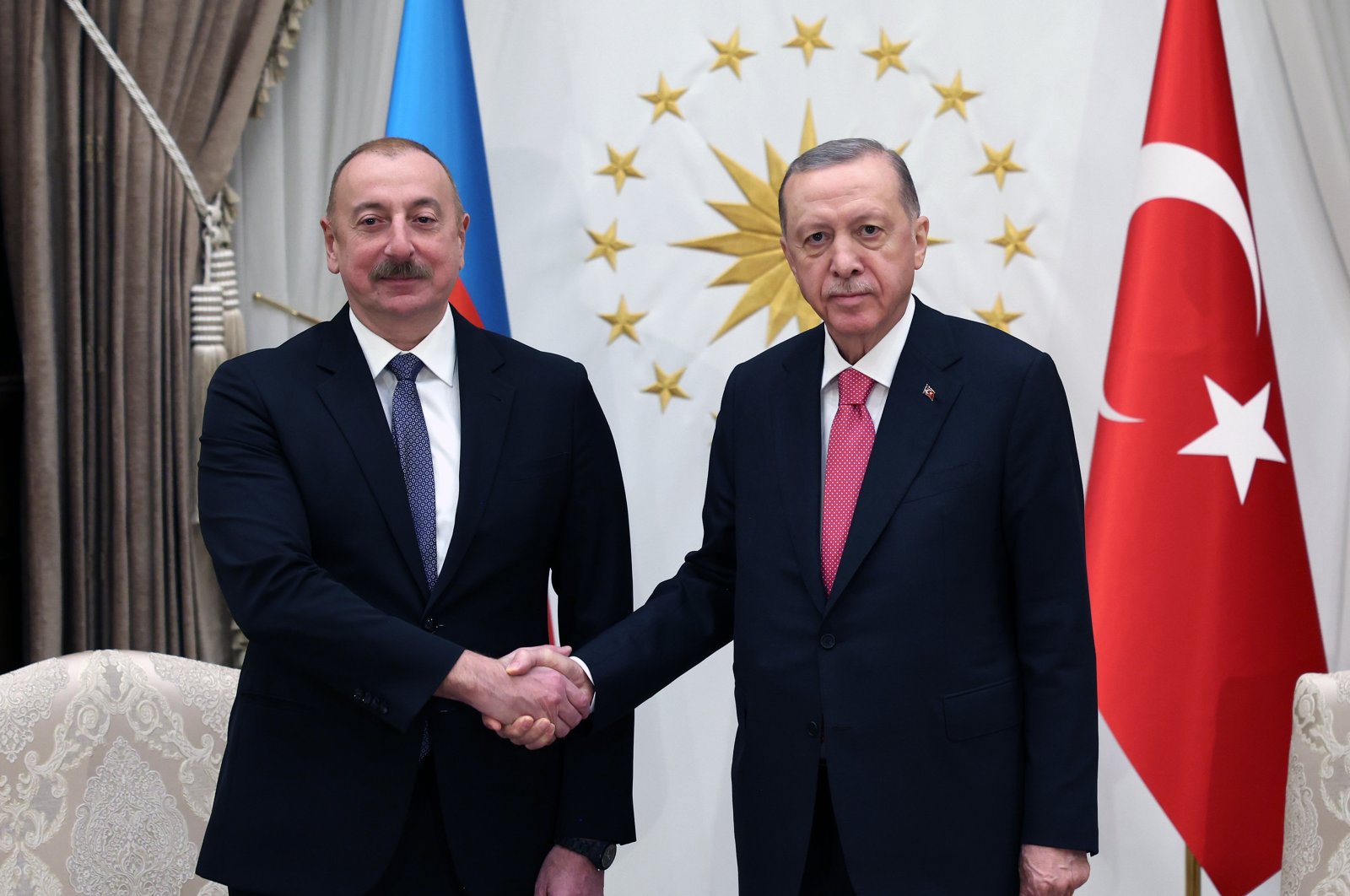 President Recep Tayyip Erdoğan shakes hands with Azerbaijan&#039;s President Ilham Aliyev (R) in the capital Ankara, Türkiye, March 15, 2023. (AA Photo)