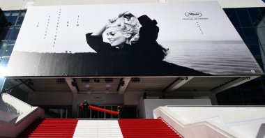 Workers prepare the red carpet ahead of the opening of the 76th Cannes Film Festival in Cannes, France, May 16, 2023. (AFP Photo)