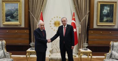 President Erdoğan (R), MHP Chair Devlet Bahçeli (L) shake hands at the Presidential Complex in Ankara, May 16, 2023. (DHA Photo)