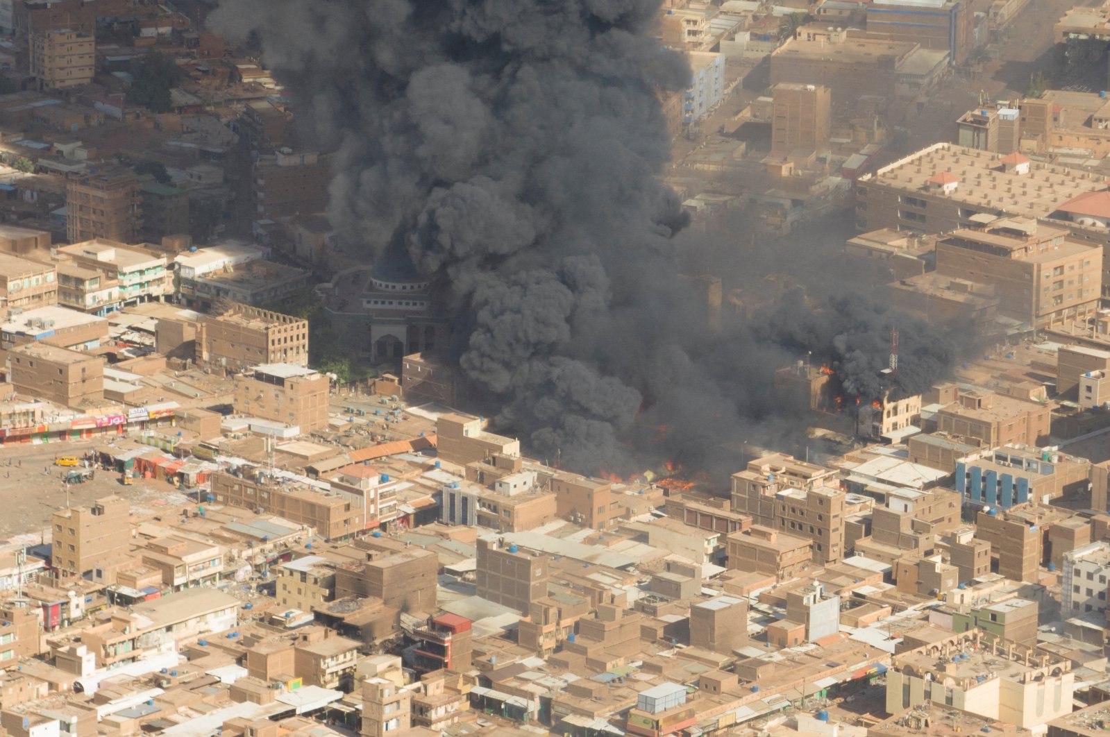 A screen grab shows black smoke and fire at Omdurman market in Omdurman, Sudan, May 15, 2023. (Reuters Photo)