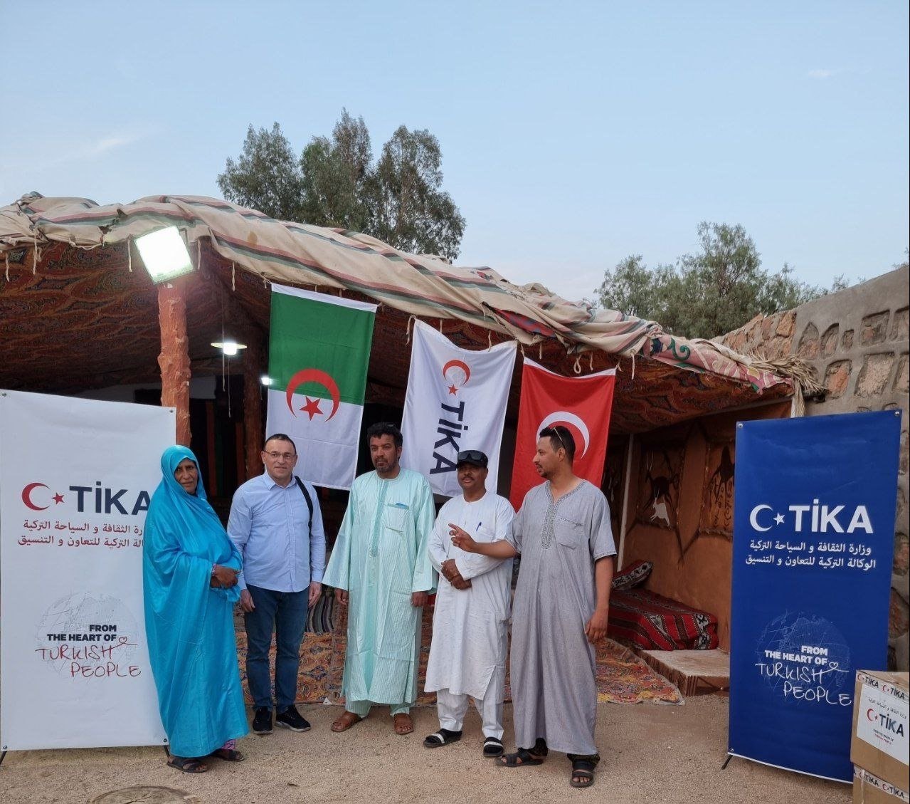 TIKA&#039;s Algeria Coordinator Gökçen Kalkan is seen with Tuareg people in the distribution ceremony, Algeria, May 17, 2023. (AA Photo)