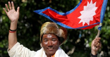Nepali mountaineer Kami Rita Sherpa waves upon his arrival after climbing Mount Everest for the 24th time in 2019, setting a record for the most summits of the world&#039;s highest mountain, Kathmandu, Nepal May 25, 2019. (Reuters Photo)