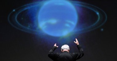 In front of an NASA image projected on a screen, National Philharmonic Music Director and Conductor Piotr Gajewski rehearses "Cosmic Cycles, A Space Symphony" by composer Henry Dehlinger, at Capital One Hall in Arlington, Virginia, U.S., May 11, 2023. (AFP Photo)