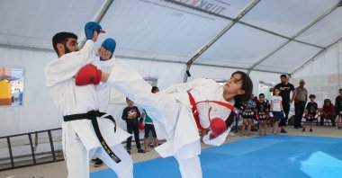 Türkiye's karateka Yağmur Fahlioğulları trains with her coach Mehmet Dağlıoğlu ahead of the Balkan Children's Karate Championships, Kahramanmaraş, Türkiye, May 16, 2023. (AA Photo)