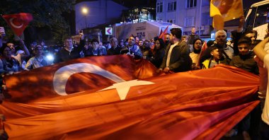 Supporters of President Recep Tayyip Erdoğan react after early results of parliamentary and presidential elections were announced in Istanbul, Türkiye, May 14, 2023. (EPA Photo)