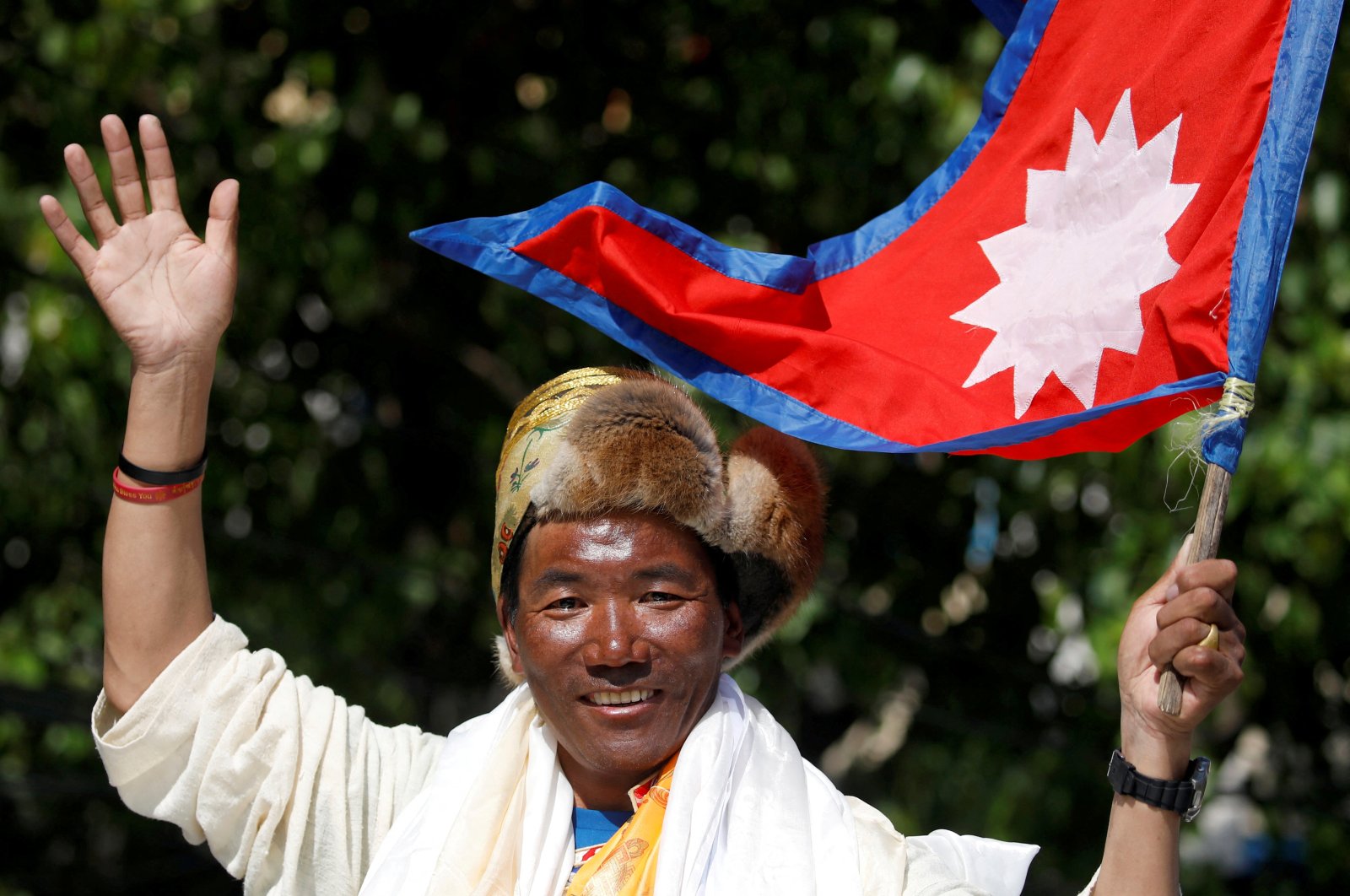 Nepali mountaineer Kami Rita Sherpa waves upon his arrival after climbing Mount Everest for the 24th time in 2019, setting a record for the most summits of the world&#039;s highest mountain, Kathmandu, Nepal May 25, 2019. (Reuters Photo)