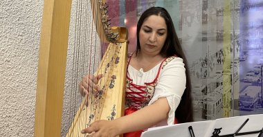 Musician Zeynep Öykü plays one of her domestically manufactured harps, in Bilecik, Türkiye, May 16, 2023. (AA Photo)