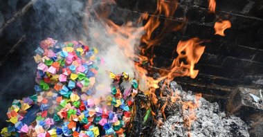 This photo shows thousands of paper cranes being burnt during a ceremony at Daisho-in Buddhist temple on the island of Miyajima, near Hiroshima, Japan, May 14, 2023. (AFP Photo)
