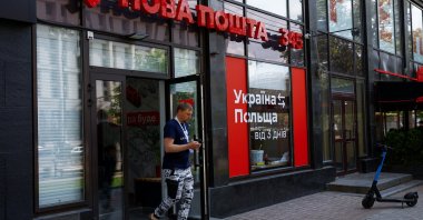 A man leaves a branch of the Nova Poshta (New Post) delivery service in downtown, amid Russia's attack on Ukraine, in Kyiv, Ukraine, May 15, 2023. (Reuters Photo)