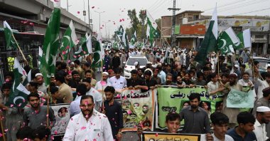 People take part in a rally to show solidarity with the Pakistani army in Peshawar after military installations were allegedly damaged by supporters of former prime minister Imran Khan following his arrest last week, Peshawar, Pakistan, May 17, 2023. (AFP Photo)