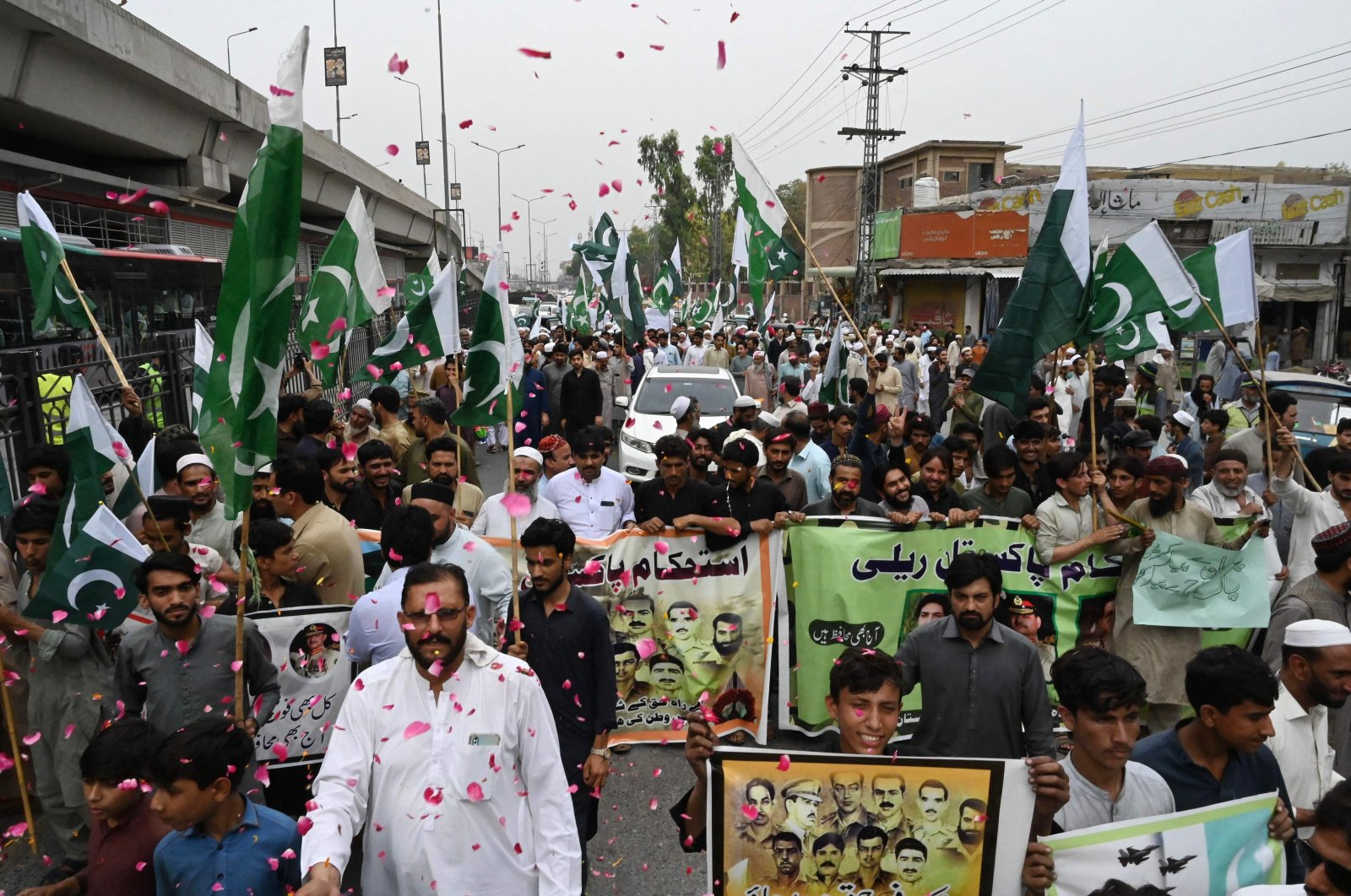 People take part in a rally to show solidarity with the Pakistani army in Peshawar after military installations were allegedly damaged by supporters of former prime minister Imran Khan following his arrest last week, Peshawar, Pakistan, May 17, 2023. (AFP Photo)
