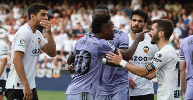 Real Madrid&#039;s Brazilian forward Vinicius Junior (C) reacts to being insulted during the Spanish league football match between Valencia CF and Real Madrid CF at the Mestalla stadium, Valencia, Spain, May 21, 2023. (AFP Photo)