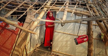 A woman surveys the damage caused to her home by Cyclone Mocha at Saint Martin island in Cox's Bazar, Bangladesh, May 15, 2023. (AP Photo)