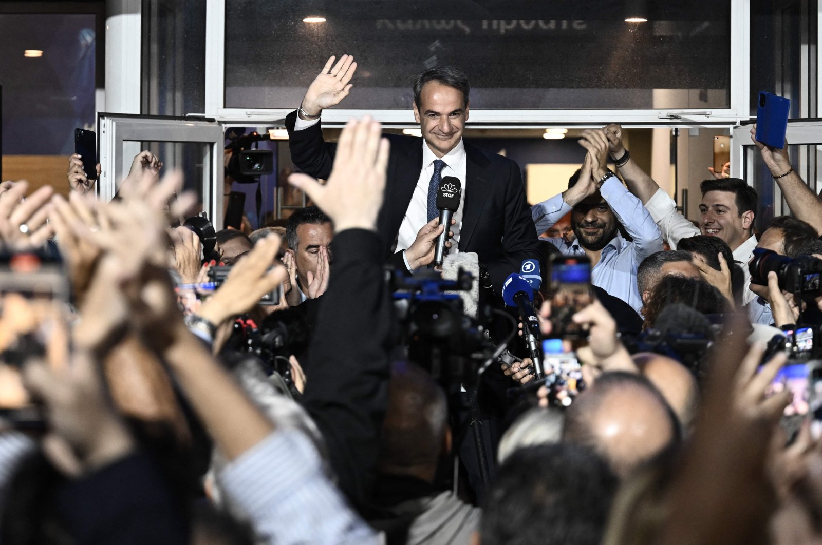 Prime Minister and New Democracy party&#039;s leader Kyriakos Mitsotakis celebrates with his supporters after his party&#039;s victory in elections in Athens, Greece, May 21, 2023. (AFP Photo)