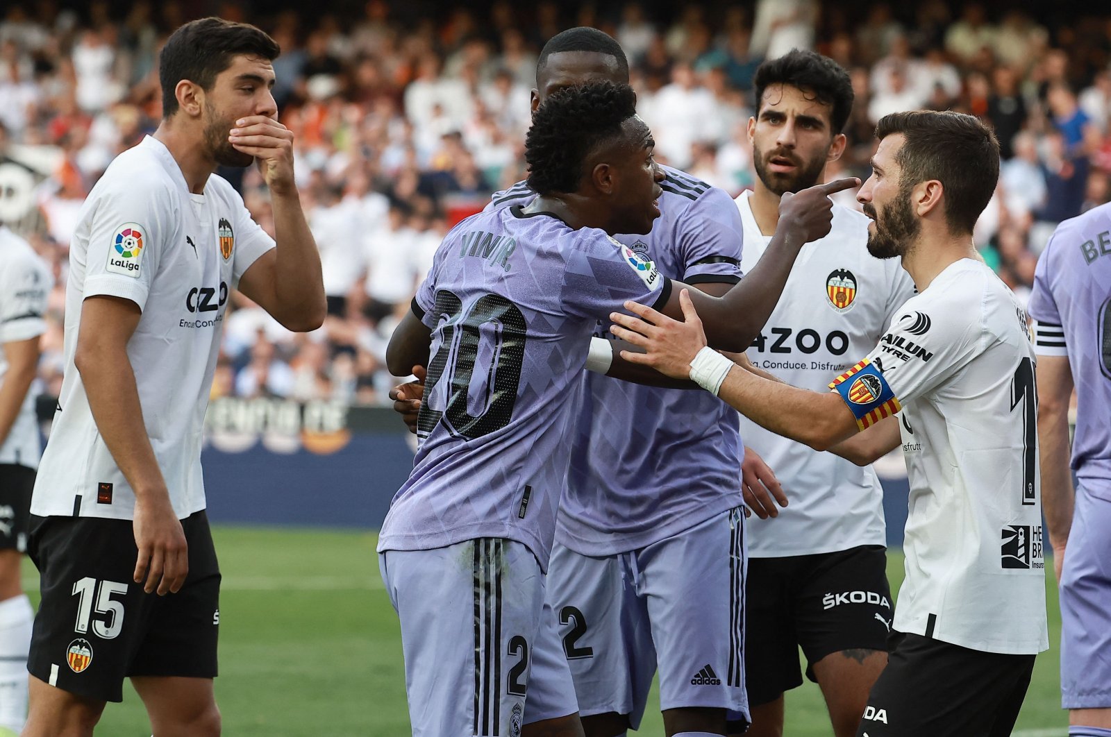 Real Madrid&#039;s Brazilian forward Vinicius Junior (C) reacts to being insulted during the Spanish league football match between Valencia CF and Real Madrid CF at the Mestalla stadium, Valencia, Spain, May 21, 2023. (AFP Photo)