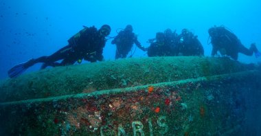 Divers are photographed next to the remains of the Paris 2 ship that sank in the Mediterranean during World War I, Antalya, southern Türkiye, May 22, 2023. (AA Photo)