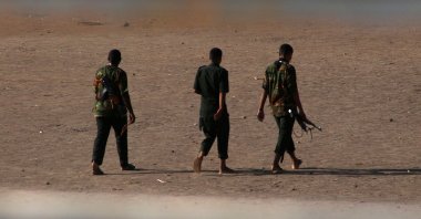 Armed men walk in Khartoum as sporadic fighting between two rival generals continues, Khartoum, Sudan, May 22, 2023, (AFP Photo)