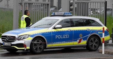 A police car leaves the grounds of Factory 56 at the plant of German car maker Mercedes-Benz in Sindelfingen, southern Germany after shots were fired at the plant on May 11, 2023. (AFP File Photo)