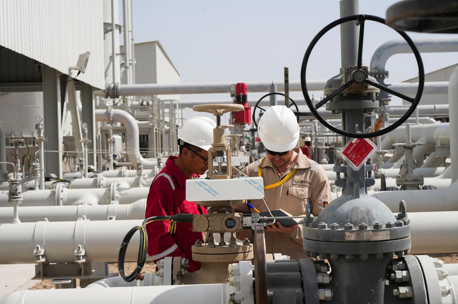Workers work at Majnoon oil field near Basra, Iraq, May 12, 2023. (Reuters Photo)
