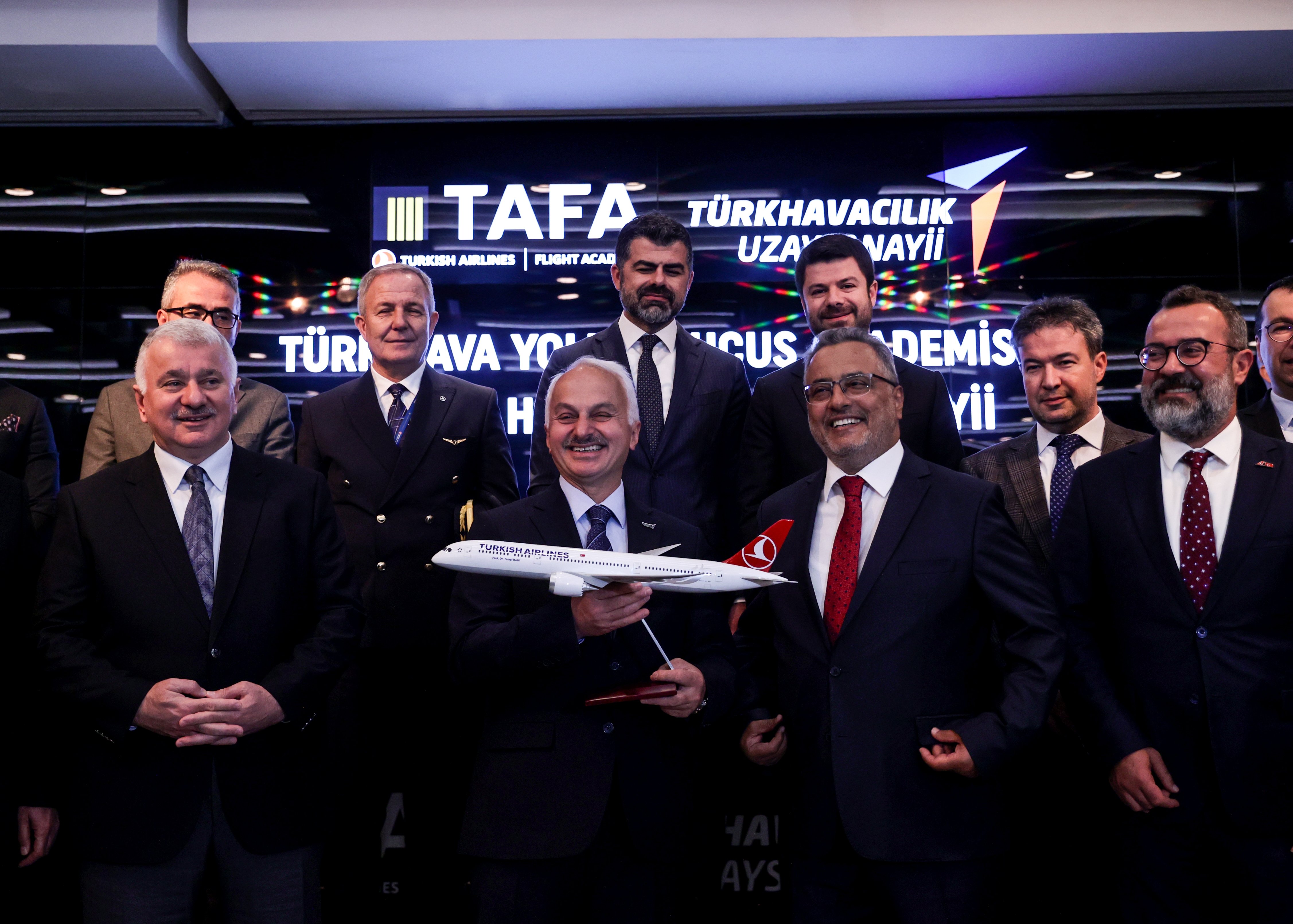 Turkish Airlines Chair Ahmet Bolat (2nd R), TAI General Manager Temel Kotil (2nd L) and other officials pose for a photo during a signing ceremony at THY&#039;s headquarters in Istanbul, Türkiye, May 23, 2023. (AA Photo)