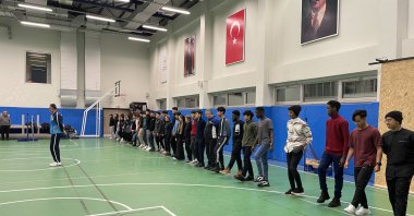 A group of foreign students is seen learning folk dance steps during a lesson at the educational center of Bartın University, Bartın, Türkiye, May 21, 2023. (AA Photo)
