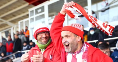 Visually impaired Ibrahim (R) and his physically disabled brother Hayri Taşçeker show support to Nevşehir Belediyespor, from the stands, Nevşehir, Türkiye, Feb. 2, 2023. (AA Photo)