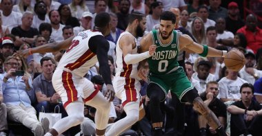 Boston Celtics' Jayson Tatum (R) drives against Miami Heat players during the fourth quarter in game four of the Eastern Conference Finals at Kaseya Center, Miami, U.S., May 23, 2023. (AFP Photo)