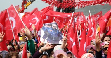 Supporters of President Recep Tayyip Erdoğan wave Turkish flags and poster of the president at a rally in earthquake-stricken Malatya province, Türkiye. May 23, 2023. (IHA Photo)