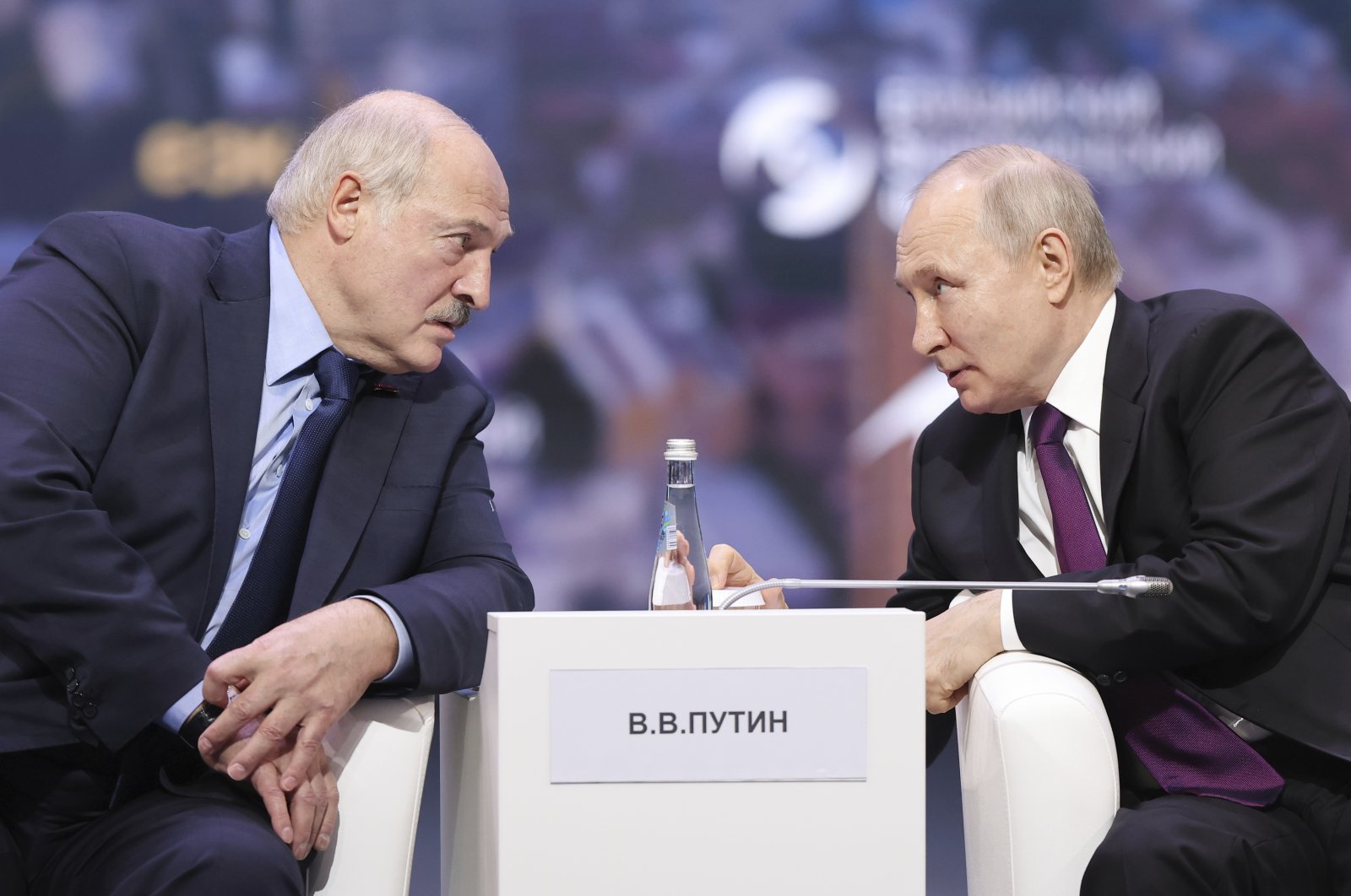 Russian President Vladimir Putin (R) and Belarusian President Alexander Lukashenko talk to each other during the plenary session of the Eurasian Economic Forum in Moscow, Russia, May 24, 2023. (AP Photo)