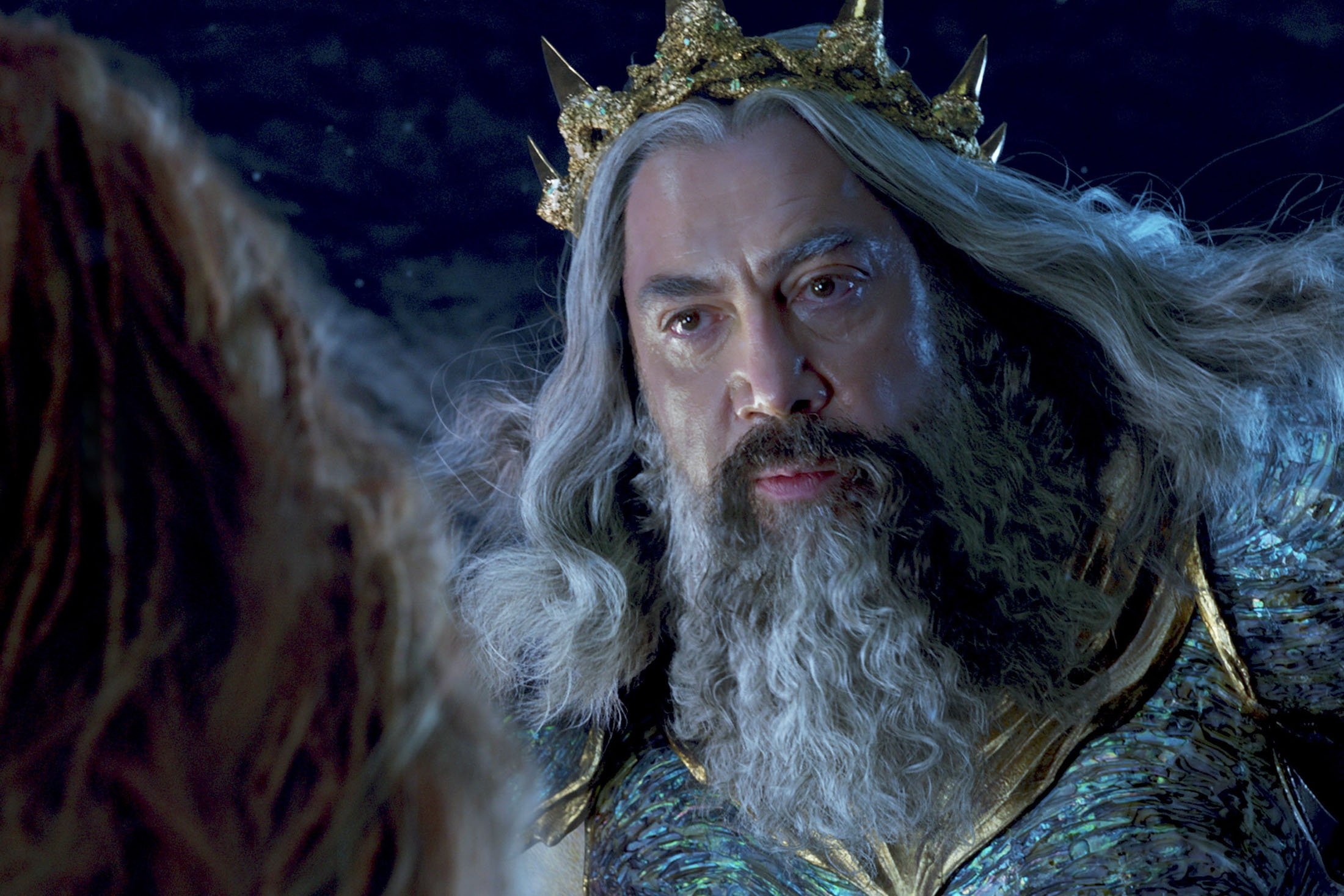 Halle Bailey (L) as Ariel, and Javier Bardem as King Triton, in a scene from the film 
