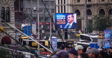 A picture of President Recep Tayyip Erdoğan is seen on a billboard on the Galata Bridge on Youth, Sports and Commemoration of Atatürk Day ahead of the presidential runoff on May 28, Istanbul, Türkiye, May 19, 2023. (Getty Images Photo)