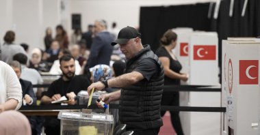 A Turkish voter casts his ballot at a polling station, in London, United Kingdom, May 21, 2023. (AA Photo) 