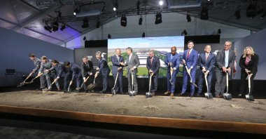 Chung Eui-sun, center left, executive chairman of Hyundai Motor Group, shakes hands with Georgia Gob. Brian Kemp as dignitaries join in for the official groundbreaking ing for the Hyundai Meta Plant, Oct. 25, 2022, in Ellabell, Georgia, U.S. (Richard Burkhart/Savannah Morning News via AP, File)