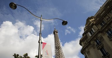 The logo of the Paris candidacy for the 2024 Olympic Games is seen in front of the Eiffel tower, Paris, France, Sept. 12, 2017. (Getty Images Photo)
