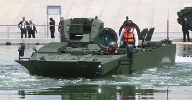 Presidency of Defense Industries (SSB) head Ismail Demir tests a recently delivered Armored Amphibious Assault Vehicle (ZAHA) in the ceremony held in Ankara, Türkiye, May 26, 2023. (AA Photo)
