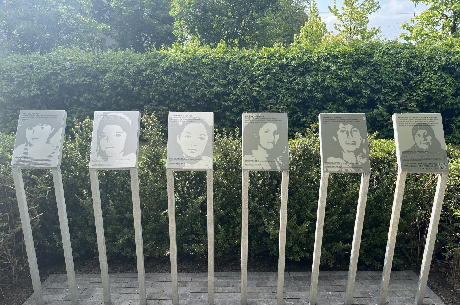 Photos of victims of the Solingen attack are seen in front of the North Rhine-Westphalia state parliament, Germany, May 26, 2023. (AA Photo)