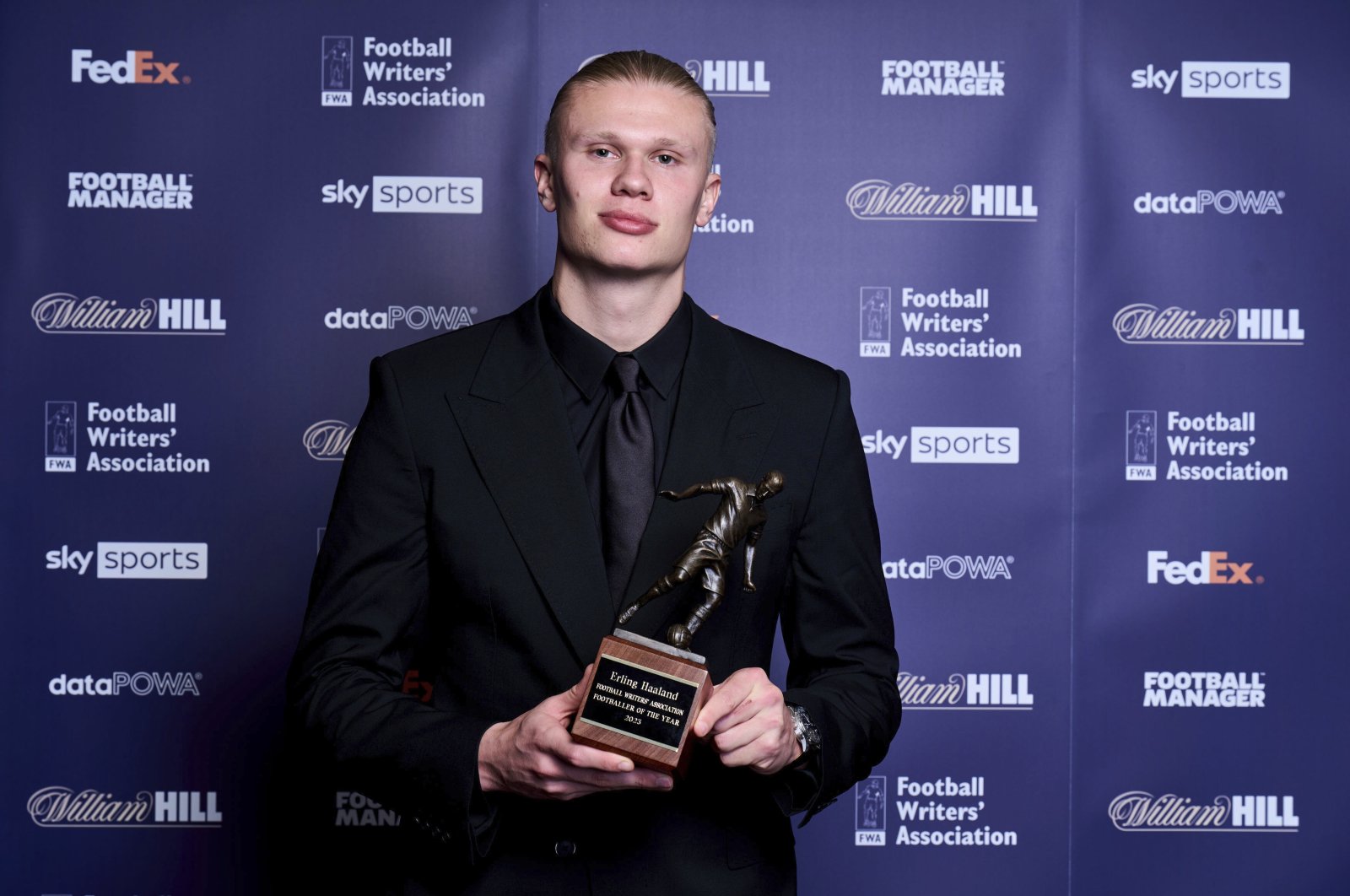 Manchester City player Erling Haaland holds the FWA trophy during the FWA Footballer of the Year awards held at the Landmark Hotel, London, U.K., May 25, 2023. (AP Photo)