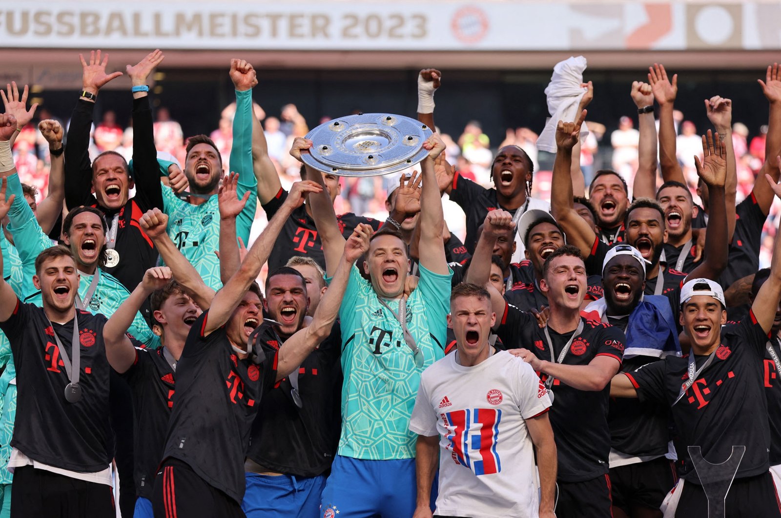 Bayern Munich players celebrate with the trophy after winning the Bundesliga, at RheinEnergieStadion, in Cologne, Germany, May 27, 2023. (Reuters Photo)