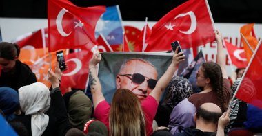 Supporters of President Recep Tayyip Erdoğan wait for his address following early exit poll results for the second round of the presidential election in Istanbul, Türkiye, May 28, 2023. (Reuters Photo)