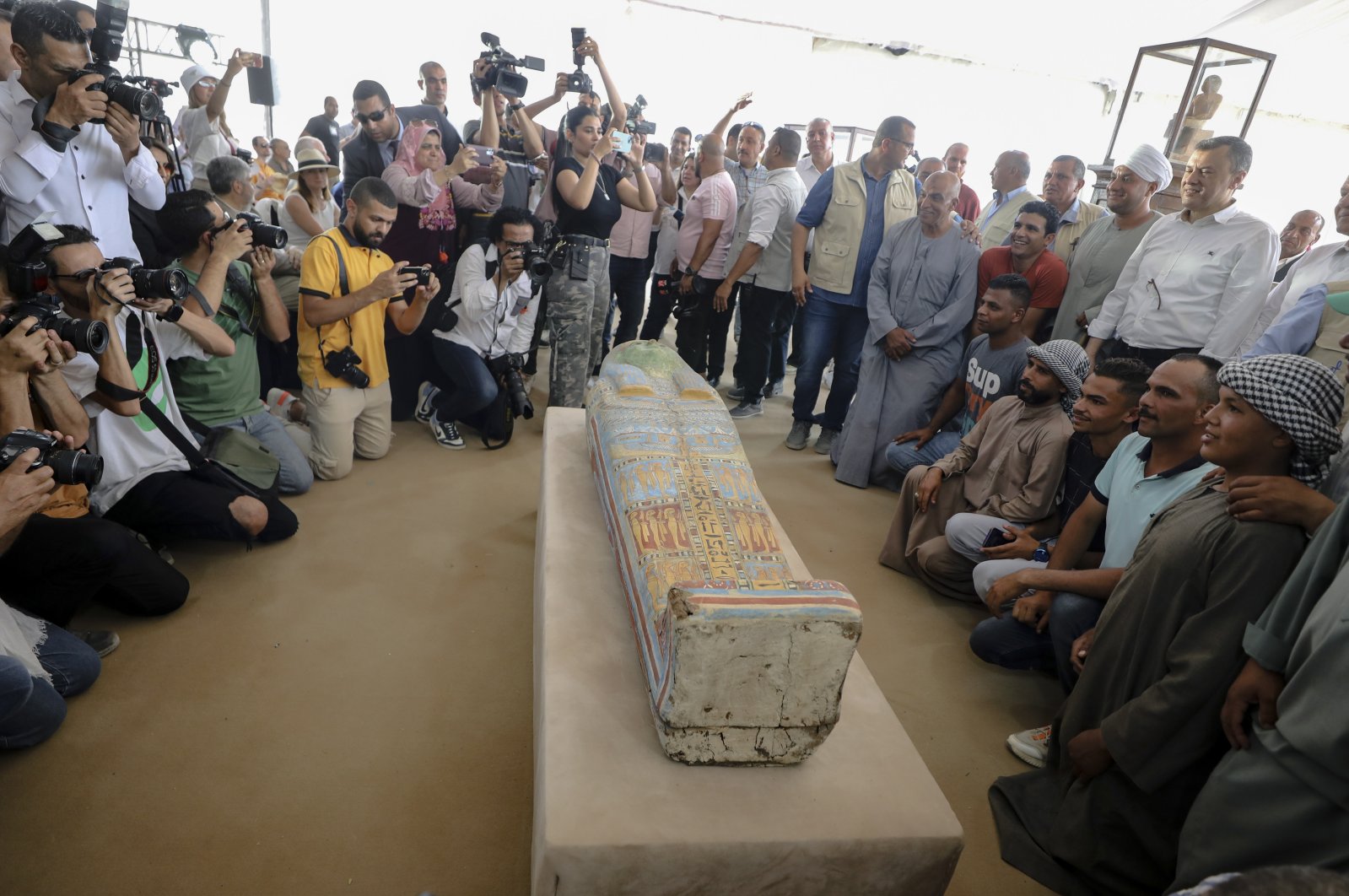 Members of the media and visitors view a sarcophagus that was found at the newly-discovered burial site in Saqqara, Giza Governorate, Egypt, May 27, 2023. (EPA Photo)