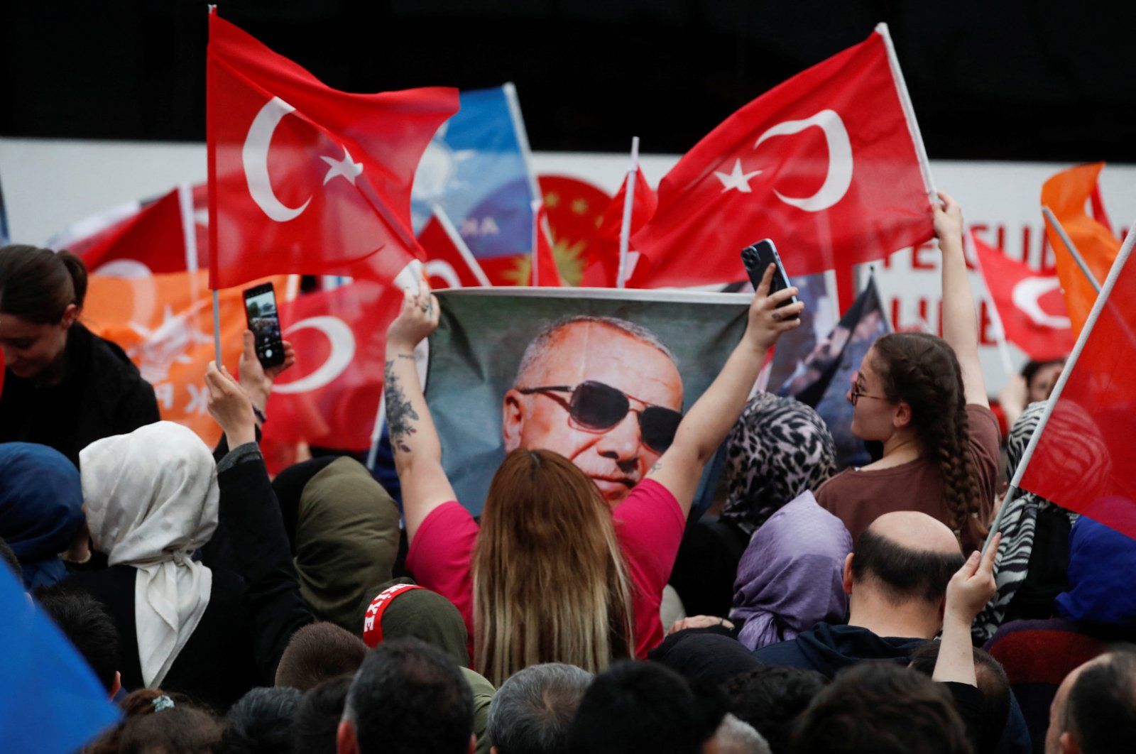 Supporters of President Recep Tayyip Erdoğan wait for his address following early exit poll results for the second round of the presidential election in Istanbul, Türkiye, May 28, 2023. (Reuters Photo)
