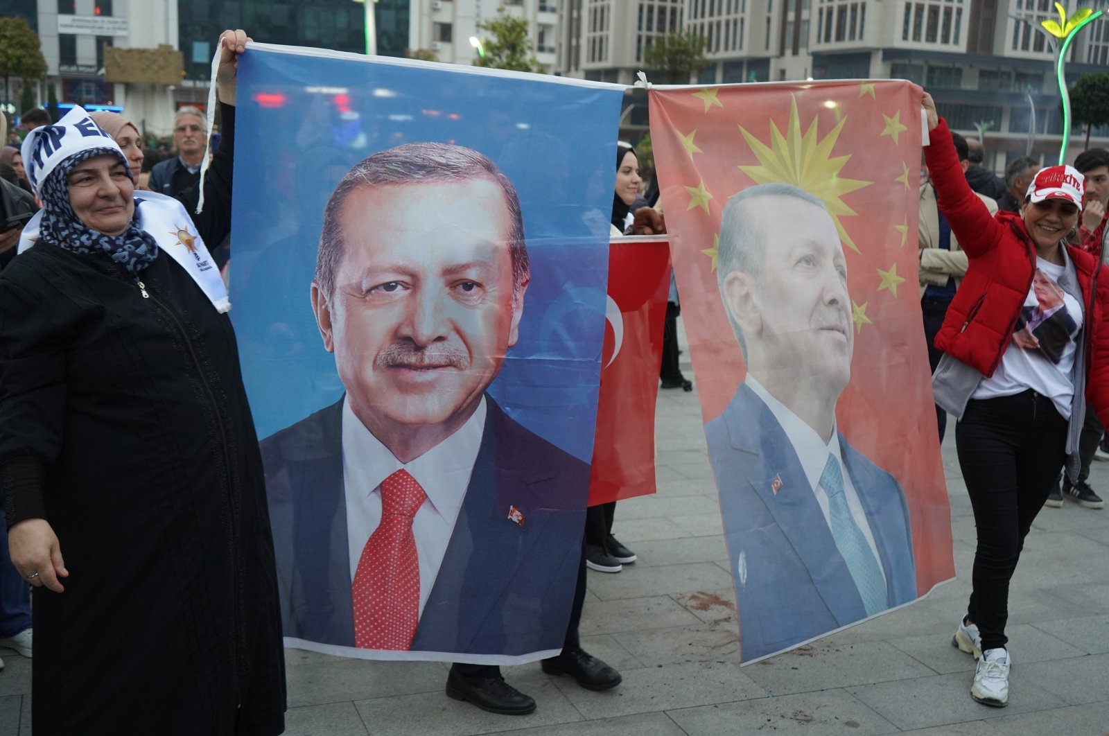 Supporters of President Recep Tayyip Erdoğan hold up flags of the president as they celebrate early victory in exit poll results for the presidential runoff in Rize, Türkiye, May 28, 2023. (IHA Photo)