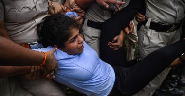 Indian wrestler Sakshi Malik is detained by the police while attempting to march to India's new parliament, just as it was being inaugurated by Prime Minister Narendra Modi, during a protest against Brij Bhushan Singh, the wrestling federation chief, over allegations of sexual harassment and intimidation, New Delhi, India, May 28, 2023. (AFP Photo)