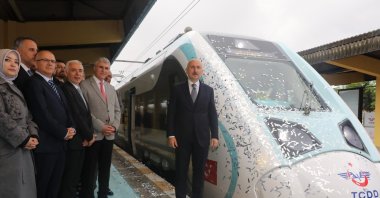 Transport and Infrastructure Minister Adil Karaismailoğlu is photographed next to the national electric train delivered by TÜRASAŞ to Turkish State Railways (TCDD), Ankara, Türkiye, May 27, 2023. (DHA Photo)