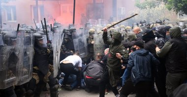 Soldiers of NATO-led international peacekeeping Kosovo Force (KFOR) scuffle with ethnic Serbs in front of the building of the municipality in Zvecan, Kosovo, May 29, 2023. (EPA Photo)