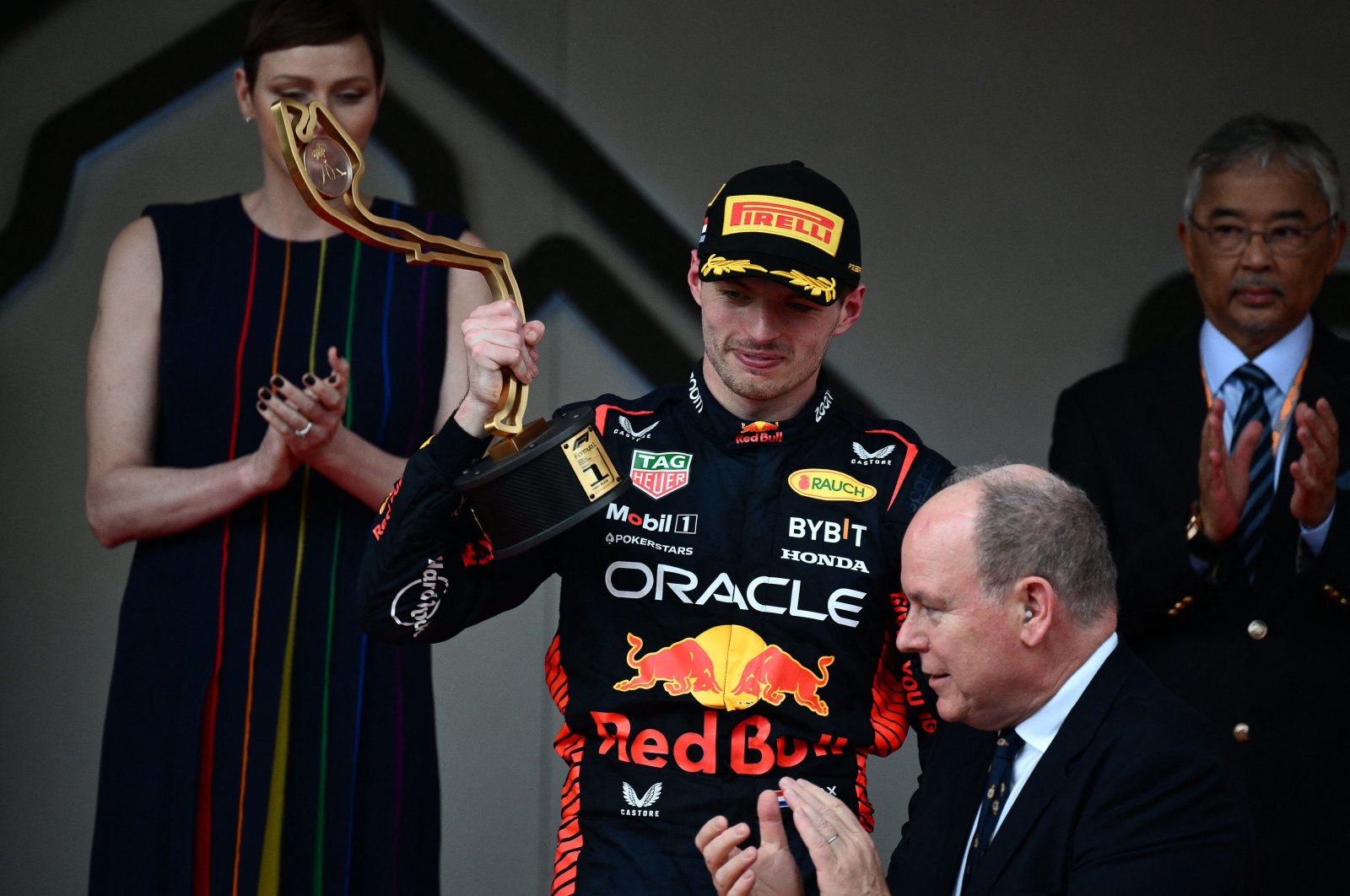 Red Bull Racing&#039;s Dutch driver Max Verstappen (C) poses with his trophy on the podium after winning the  Formula One Monaco Grand Prix at the Monaco street circuit, Monaco, France, May 28, 2023. (AFP Photo)