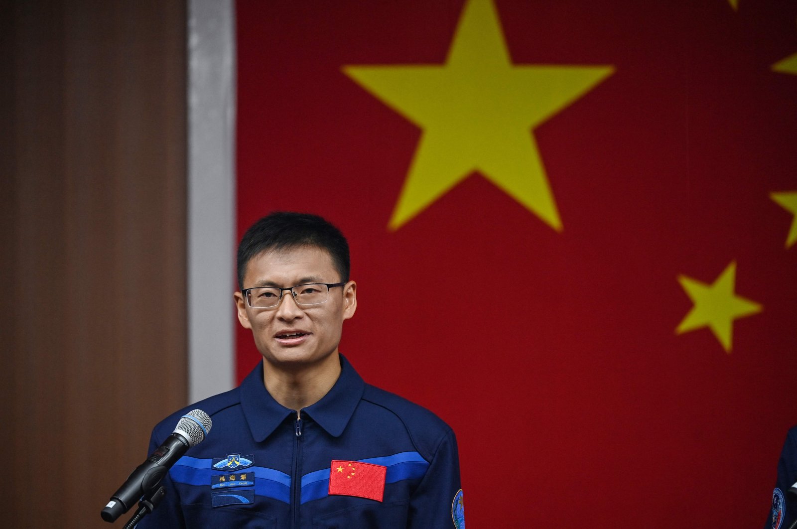 Taikonauts Gui Haichao payload expert of the Shenzhou-16 Manned Space Flight Mission speaks during a press conference at the Jiuquan Satellite Launch Center, in northwestern Gansu province, China, May 29, 2023. (AFP Photo)