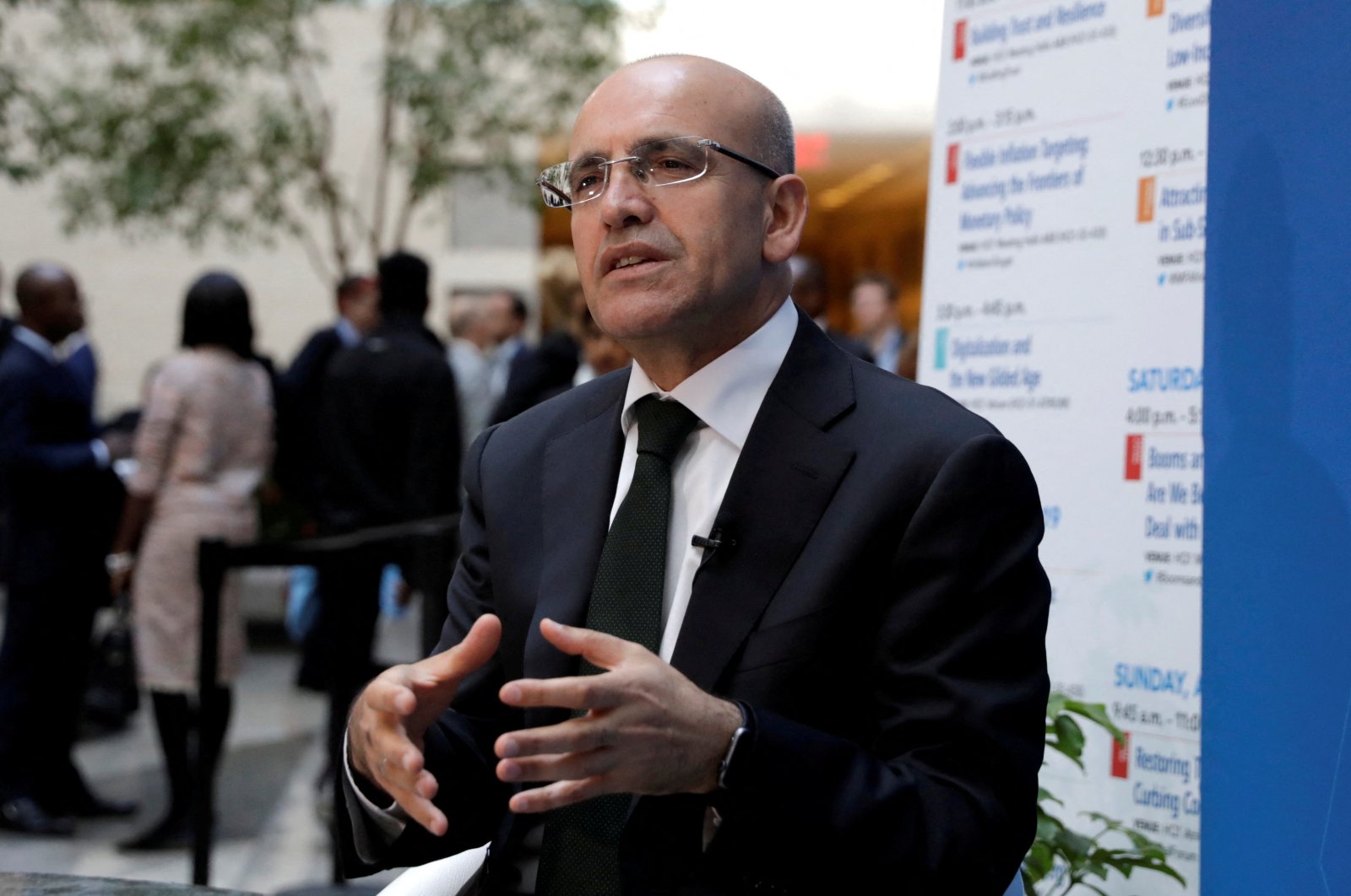 Former Finance Minister Mehmet Şimşek speaks during a television interview after IMFC plenary at the International Monetary Fund (IMF)/World Bank spring meeting in Washington, U.S., April 20, 2018. (Reuters Photo)